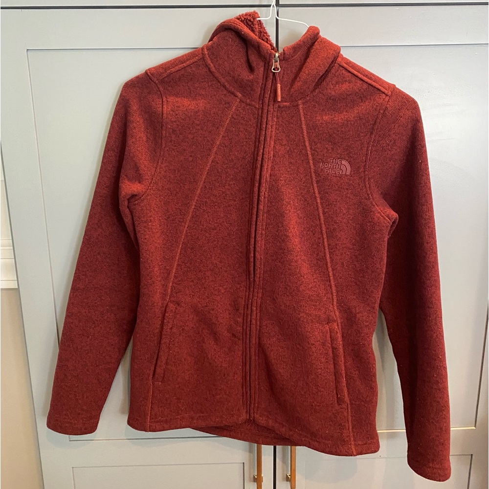 Maroon women’s fleece lined North Face zip up hoodie